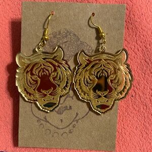Gold tone engraved tiger earrings. Never worn. Bought at a craft show.